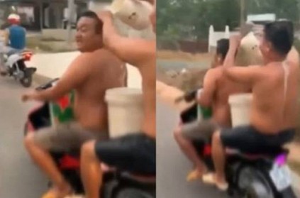 vietnam men bathing while riding in bike video viral