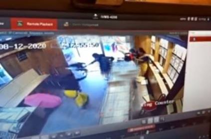Bold jewellery shop woman staff hits armed thief by chair