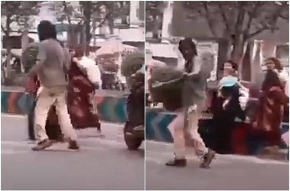 Demented man clears traffic for women and kid cross road