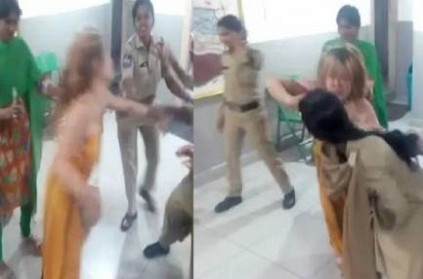 Drunken IT Woman Tries to Bite Cop in police staion