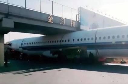 Flight got stuck under bridge in china video goes bizarre