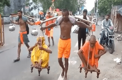 Man Carries Old Parents On Shoulders For Kanwar Yatra