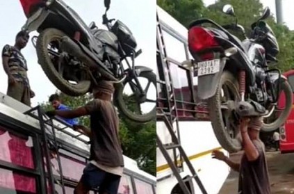 man climbs bike on his head in bus ladder video amazed people