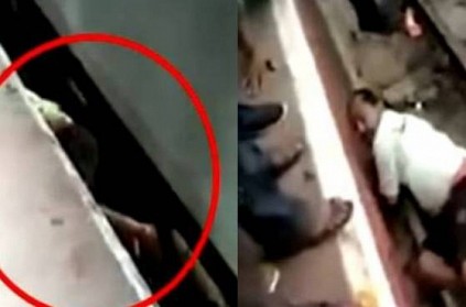 man lie down in the track while the train crossing him in Mumbai