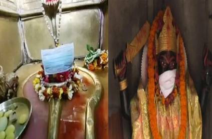 man put face mask to God in Varanasi after coronavirus spread