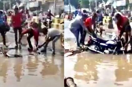 Men Recover Submerged Bike from Pothole After Heavy Rain, Viral Video