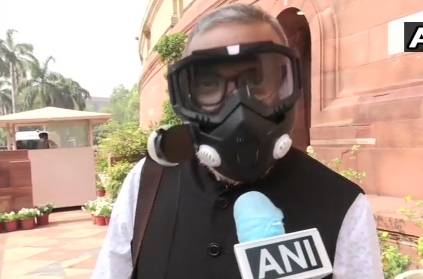 MP Narendra Jadhav wears High-Efficiency Particulate Air filter mask