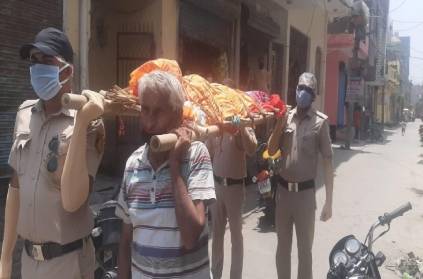Three policemen who helped the man to bury his wife