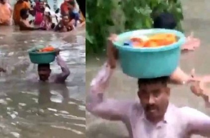 WATCH: Gujarat cop saving a baby from floods goes viral