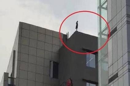 Woman on office terrace stood on the edge and threatened to jump off