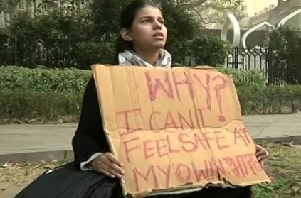 Woman protests outside Parliament over crimes against women