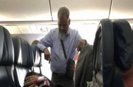 Inspiring husband standing for his wife to sleep in flight