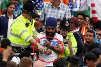 A fan is arrested by police for political protest during INDvsNZ