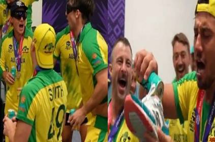 Australian team players drinking beer straight from shoe