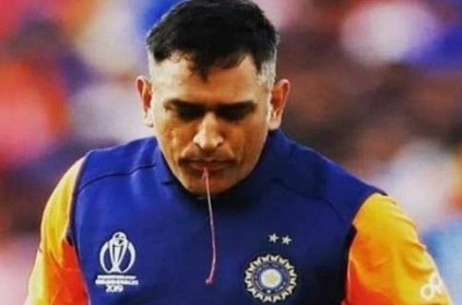 Dhoni spitting blood after an injured thumb during IND vs ENG match