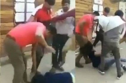 mob of men dragging a woman by her hair and brutally thrashing her