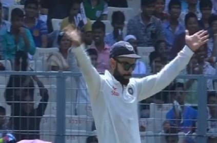 captain virat kohli cheers the team bowlers from the dugout