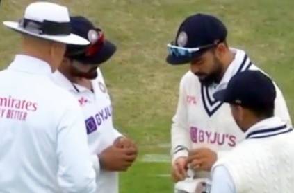 Virat Kohli removing tape from wicketkeeper Rishabh Pant gloves