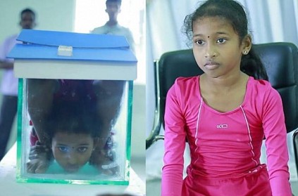 9 year old girl creates world record doing yoga in fish tank