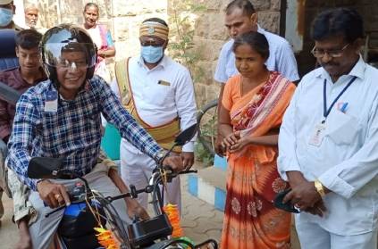 madurai collector buys bike for disabled youth at his own expense