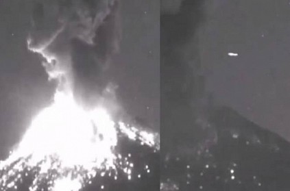 Mysterious light flashes behind erupting volcano, Alien debate