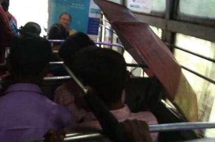 passengers using umbrella to in Valparai Bus due to rain