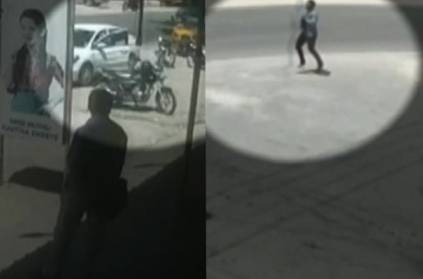 Thief runs happily by jumping after stealing money from car