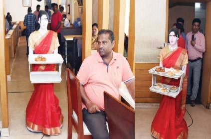 Robot serving food to customer silk saree at Mysore Hotel