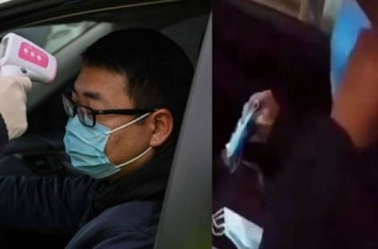 A Chinese man wore a 12 mask on his face to protect himself