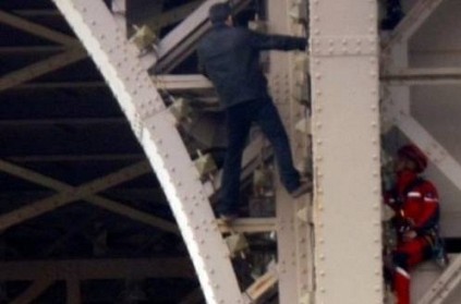 Eiffel Tower has been closed after man spotted climbing up its side