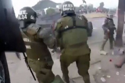 female Chilean riot police officers caught fire i protest