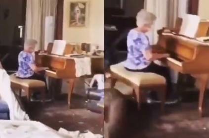 lebanon expolsion : old woman plays piano amid home in ruins