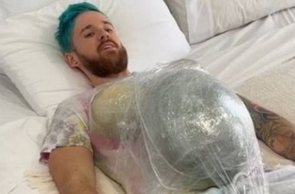 Man tries to be simulate pregnancy for a day by adding weights to body