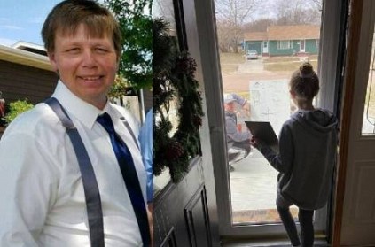 Math teacher brings over whiteboard to help student through glass door
