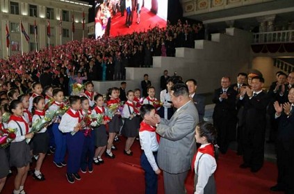 North Korea’s Kim Jong Un presides over late-night parade