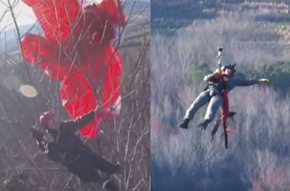 Paraglider rescued after being stuck in a tree for hours