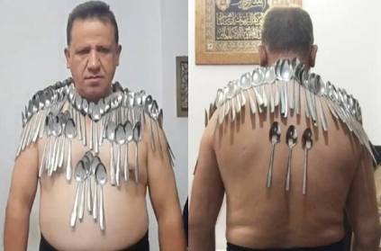 iran man balance 85 spoons in his body guinness record