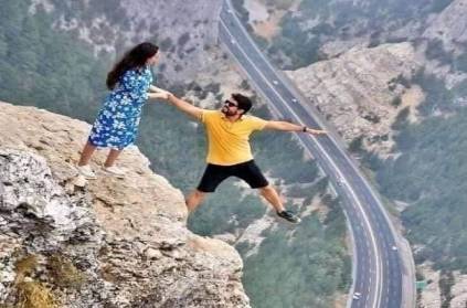 Photo of couple standing on cliff’s edge goes viral