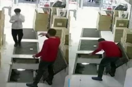 Youth falls through open hatch while using mobile