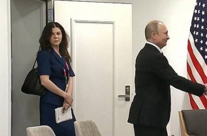 Putin hired an attractive female translator to distract Trump