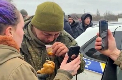 Russian soldier surrenders to Ukrainian people who feed him