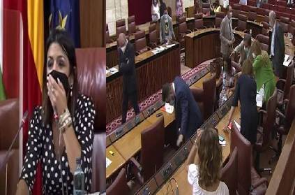 spain politicians scramble to their feet rat enters parliament