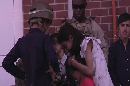 usa service members interact with children kabul airport