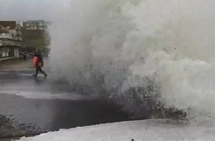 VIDEO: Man and child almost swept away by sea wave