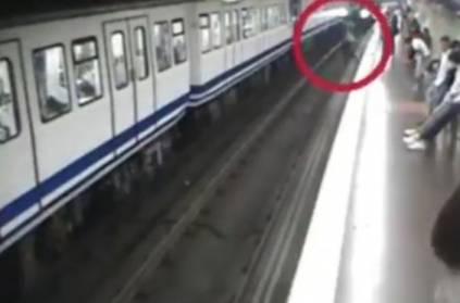 Woman on phone slips and falling in front of metro train