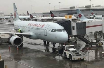 Woman stuck in parked Air Canada plane