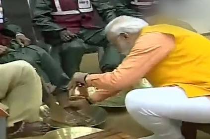 PM Modi washed and wiped the feet of five sanitation workers