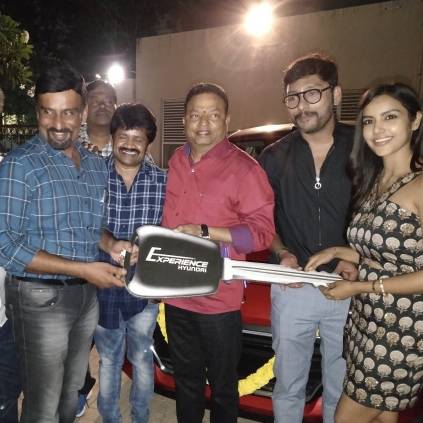 R.J.Balaji's LKG team gifts a brand new car to Director Prabhu