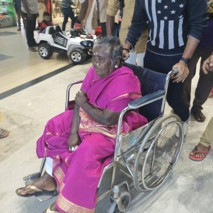 Paravai Muniamma watches movie in theater with wheel chair